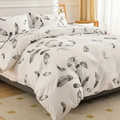 King size 6 piece duvet cover set, white bed linen with gray feathers.